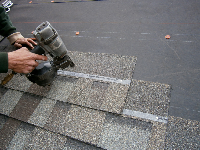 Image of a roof being shingled